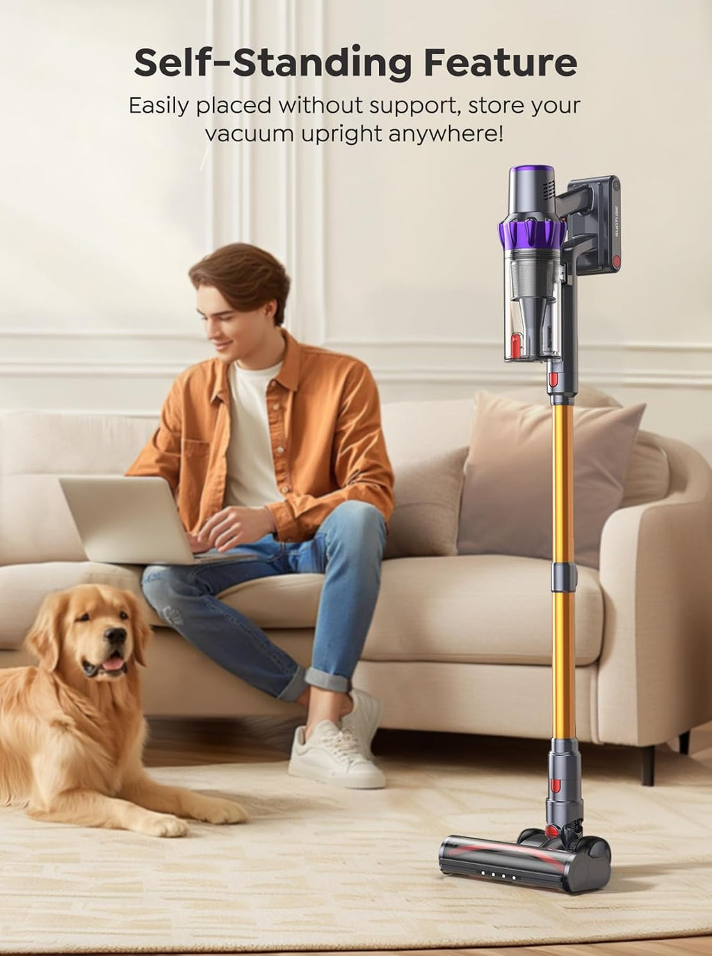 Person sitting on a couch with a dog, using a laptop, and a self-standing vacuum cleaner in the foreground.